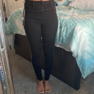 Black jeans with rhinestones down the sides